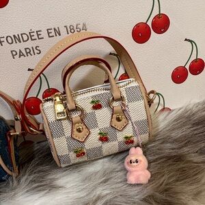 Miniature Vuitton Murakami cherry speedys with baby labubu charms